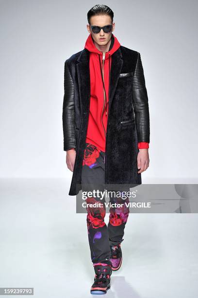 Model on the catwalk during the Katie Eary Ready to wear Fall/Winter 2013-2014 show at the London Collections: MEN AW13 at The Hospital Club on...