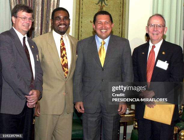 The president of Venezuela, Hugo Chavez , poses for a photo with American senators Mark Sounder , Gregory Meex , and Cass Ballenger after a meeting...