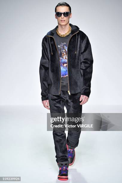 Model on the catwalk during the Katie Eary Ready to wear Fall/Winter 2013-2014 show at the London Collections: MEN AW13 at The Hospital Club on...