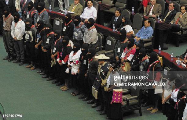 This photo shows Zapatista leaders as they wait for the Congress session to start in Mexico City, Mexico, 28 March 2001. Comandantes del Ejercito...