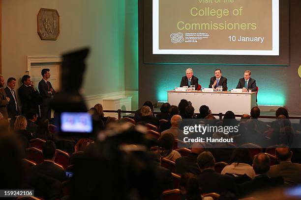 In this handout image provided by Justin MacInnes, Tánaiste Eamon Gilmore , Jose Manuel Barroso, President of the European Commission and Taoiseach...