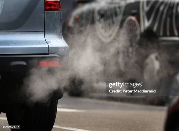 Exhaust fumes from a car in Putney High Street on January 10, 2013 in Putney, England. Local media are reporting local environmental campaigners...