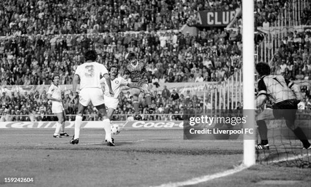 Ronnie Whelan of Liverpool heads the ball down as he is challenged by the AS Roma defence during the UEFA European Cup Final between AS Roma and...