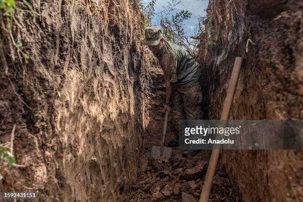 Ukrainian soldier digs trenches on the frontline as the war between Russia and Ukraine continues in Donetsk Oblast, Ukraine on August 10, 2023.