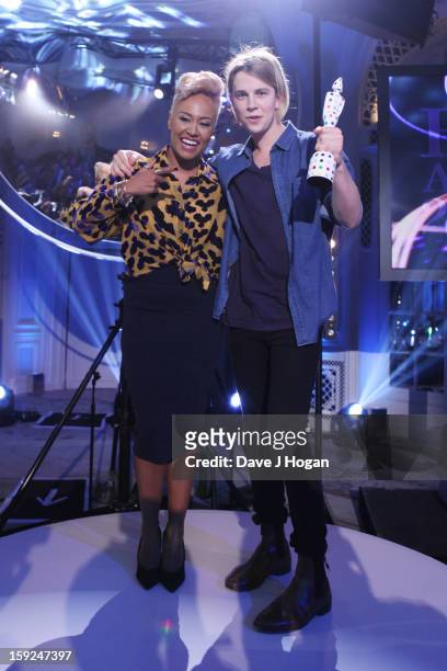 Emeli Sande presents Tom Odell with the BRIT's Critics Choice Award at The BRIT Awards 2013 nominations announcement at The Savoy on January 10, 2013...