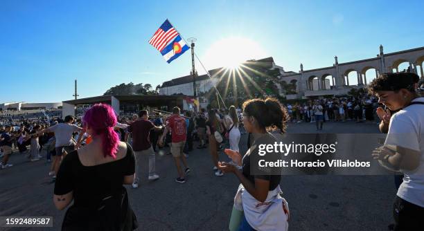 Young U.S. Pilgrims dance upon arrival in late afternoon at the sanctuary premises as members of the faithful of all ages and nationalities start...