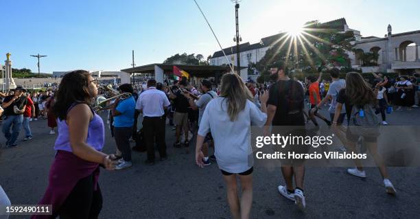 Young U.S. Pilgrims dance upon arrival in late afternoon at the sanctuary premises as members of the faithful of all ages and nationalities start...