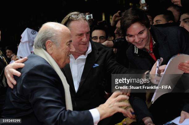 President Joseph S. Blatter and French actor actor Gerard Depardieu during the red carpet arrivals at the FIFA Ballon d'Or Gala 2012 at the...