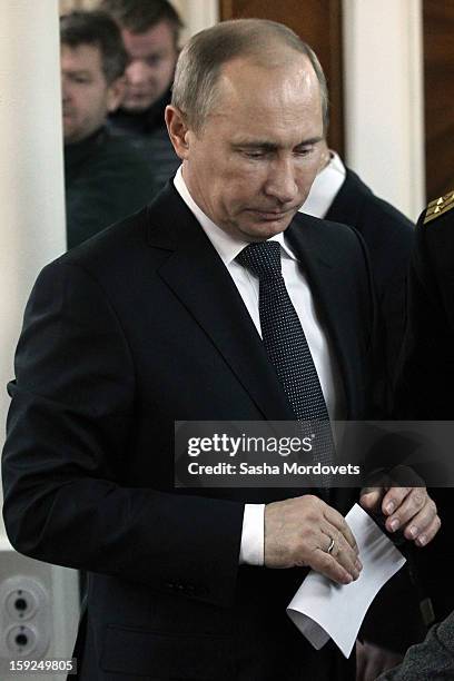 Russian President Vladimir Putin visits the heavy nuclear-powered missile cruiser Pyotr Veliky at the Russian Northern Fleet's base January 10, 2013...