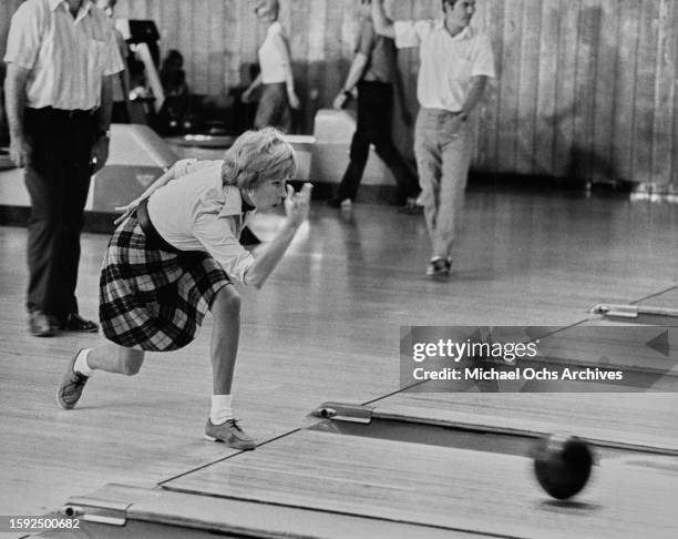 Carol Burnett bowling during filming, United States, circa 1970s.