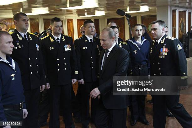 Russian President Vladimir Putin visits the heavy nuclear-powered missile cruiser Pyotr Veliky at the Russian Northern Fleet's base January 10, 2013...