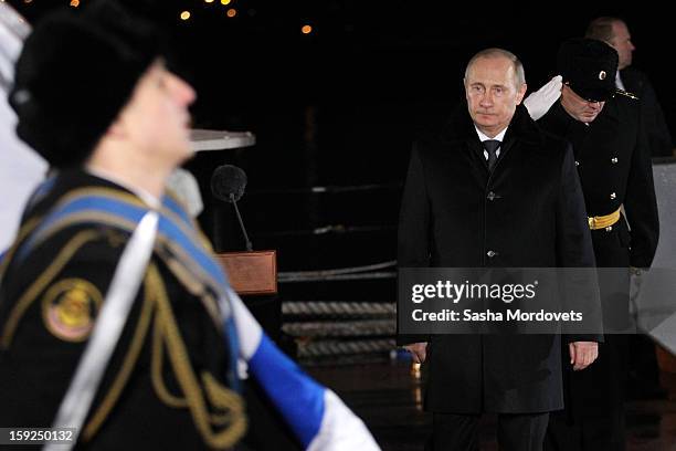 Russian President Vladimir Putin visits the heavy nuclear-powered missile cruiser Pyotr Veliky at the Russian Northern Fleet's base January 10, 2013...