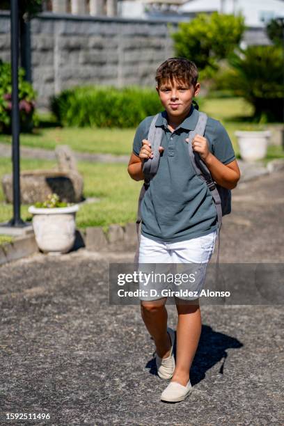 boy pupil with bagpack - bagpack stock pictures, royalty-free photos & images