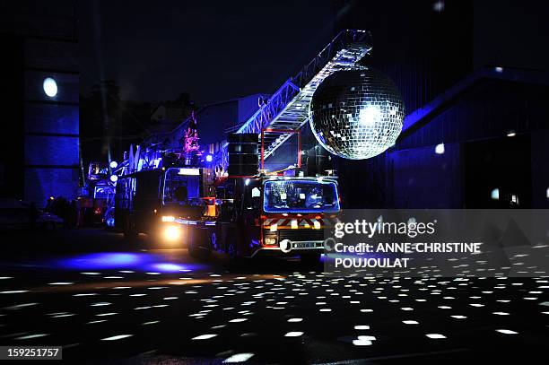 Artists perform on January 10, 2013 in Marseille southern France, during a rehearsal of the Light Parade by Sud Side Company ahead of the 2013...