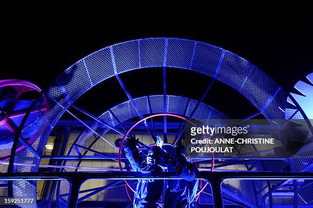 Students and artists perform on January 10, 2013 in Marseille southern France, during a rehearsal of the Light Parade by Sud Side Company ahead of...