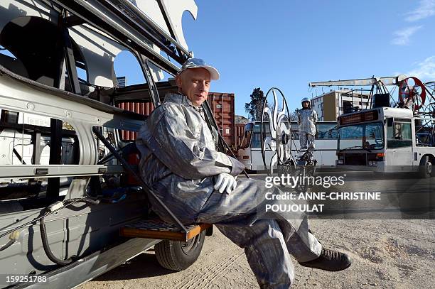 Artists wait on January 10, 2013 in Marseille southern France, prior to the begining of a rehearsal of the Light Parade by Sud Side Company ahead of...