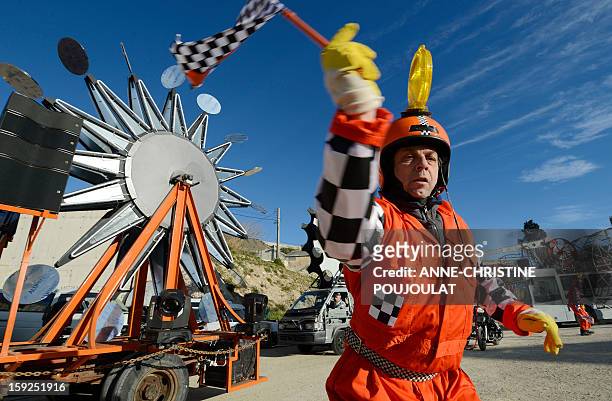 An artist performs on January 10, 2013 in Marseille southern France, during a rehearsal of the Light Parade by Sud Side Company ahead of the 2013...