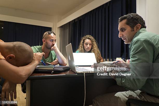 Bassem Youssef keeps an eye on the process as he and his writers parse ideas for the upcoming season on October 04 in Cairo, Egypt. Youssef is an...