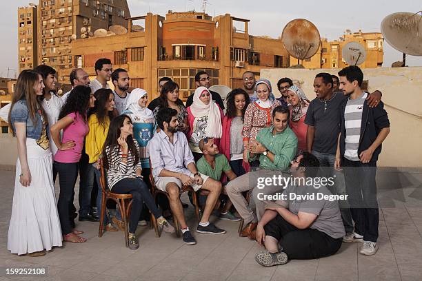 Bassem Youssef sits with some of his researchers and writers on top of their temporary offices while their new offices are being renovated, on...