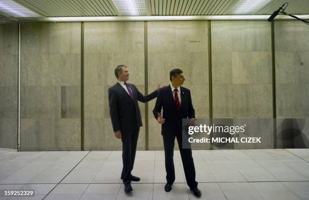 Presidential candidates Jiri Dienstbier and Jan Fischer gesture prior to the pre-election's TV debate on January 10, 2013 in Prague. The first Czech...