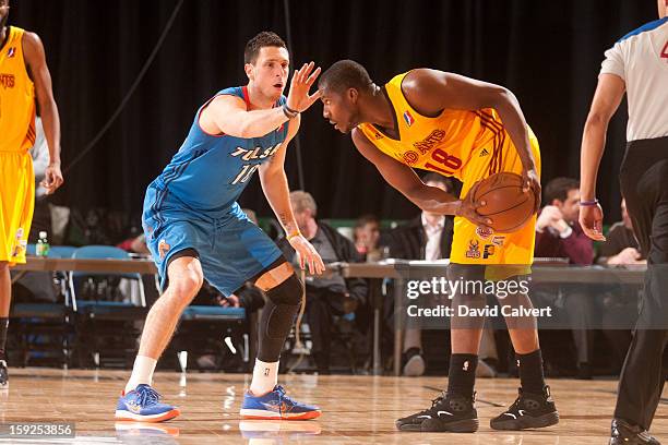 Andy Rautins of the Tulsa 66ers guards Tony Mitchell of the Fort Wayne Mad Ants during the 2013 NBA D-League Showcase on January 10, 2013 at the Reno...