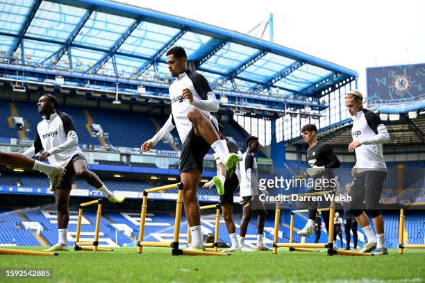 Axel Disasi, Levi Colwill and Mykhailo Mudryk of Chelsea during a training session at Stamford Bridge on August 11, 2023 in London, England.