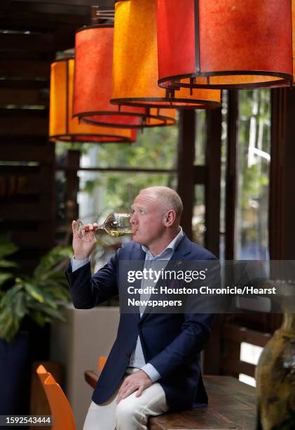 Dale Ellington, wine buyer at Kata Robata, with a 2012 Nova Domus from Terlano winery,Thursday, May 5 in Houston.