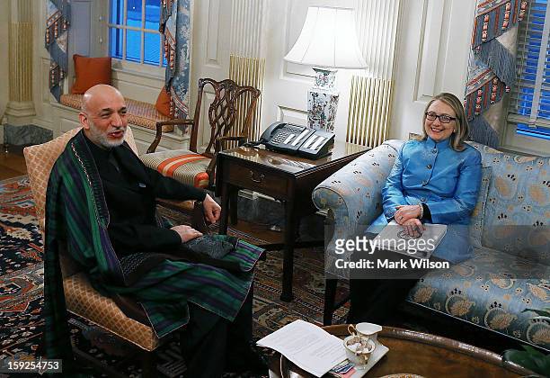Secretary of State Hillary Clinton meets with Afghan President Hamid Karzai at the State Department January 10, 2013 in Washington, DC. Karzai is on...