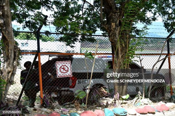 Colombian anti-explosive police prepare to deactivate a suitcase loaded with explosives next to the Camilo Daza international airport in Cucuta,...