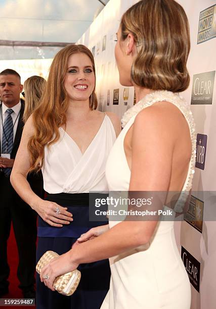 Actresses Amy Adams and Emily Blunt attend the 18th Annual Critics' Choice Movie Awards held at Barker Hangar on January 10, 2013 in Santa Monica,...