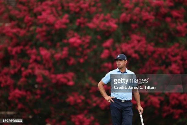 Gary Woodland of the United States looks on from the ninth green during the second round of the Wyndham Championship at Sedgefield Country Club on...