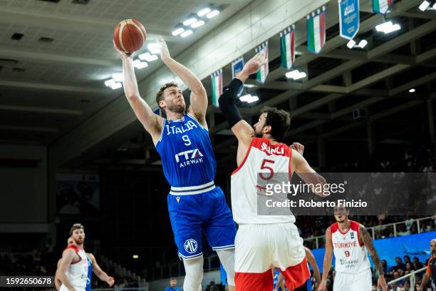 Nicolò Melli of Italy and Sertac Sanli of Turkey in action during Trentino Basket Cup 2023 game between Italy and Turkey at BLM Group Arena on August...