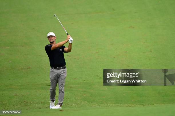 Ryan Moore of the United States plays a shot on the ninth hole during the second round of the Wyndham Championship at Sedgefield Country Club on...