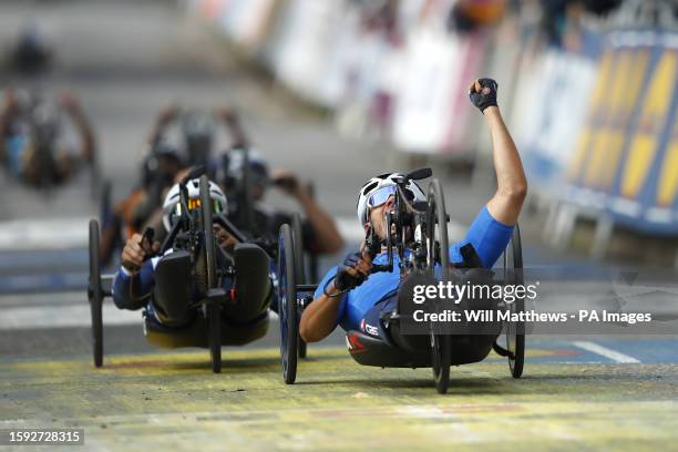 Italy's Mirko Testa celebrates winning the Men H3 Road Race with France's Johan Quaile second on day nine of the 2023 UCI Cycling World Championships...