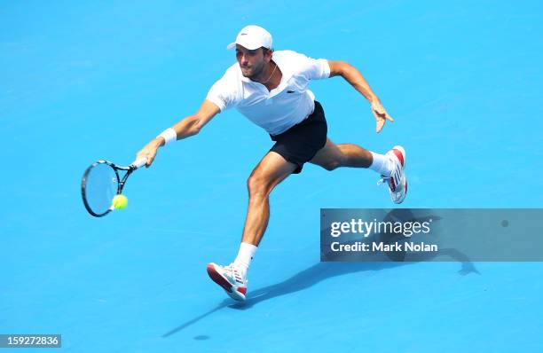 Julien Benneteau of France plays a forehand in his semi final match against Kevin Anderson of South Africa during day six of the Sydney International...