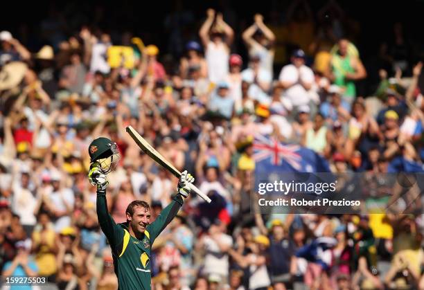 Phillip Hughes of Australia celebrates his century during game one of the Commonwealth Bank One Day International series between Australia and Sri...