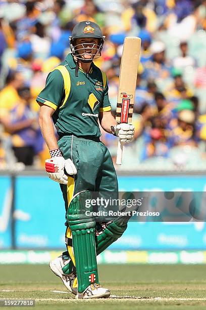 George Bailey of Australia celebrates scoring his half century during game one of the Commonwealth Bank One Day International series between...