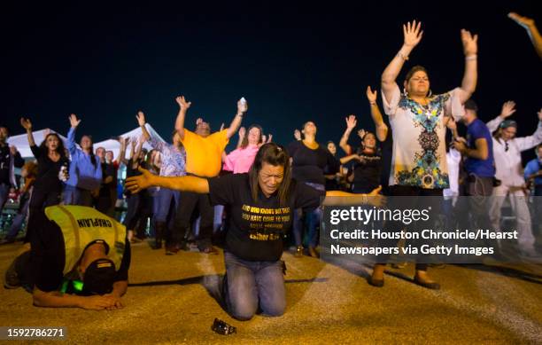 Yvette Gonzalez, of San Antonio, kneels as she prays during a vigil and worship service in Sutherland Springs, Monday evening, Nov. 6 in Sutherland...