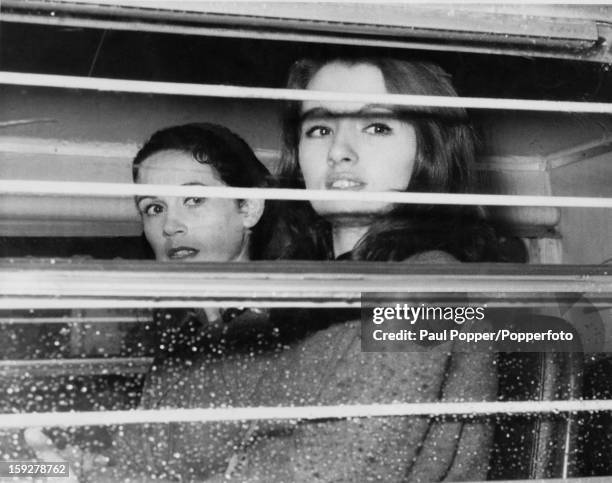 English former model and showgirl Christine Keeler and her friend Paula Hamilton-Marshall in a police van on their way from Marylebone Lane police...