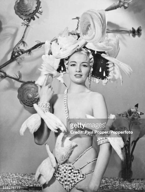 English model and showgirl Christine Keeler, in a stage outfit, circa 1962. Keeler's affair with British Secretary of State for War, John Profumo,...