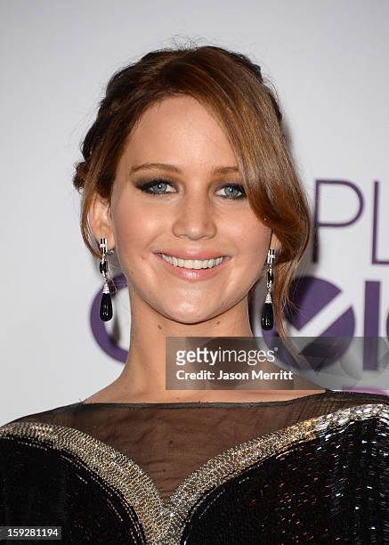Actress Jennifer Lawrence, winner of Favorite Movie Actress, poses in the press room at the 39th Annual People's Choice Awards at Nokia Theatre L.A....