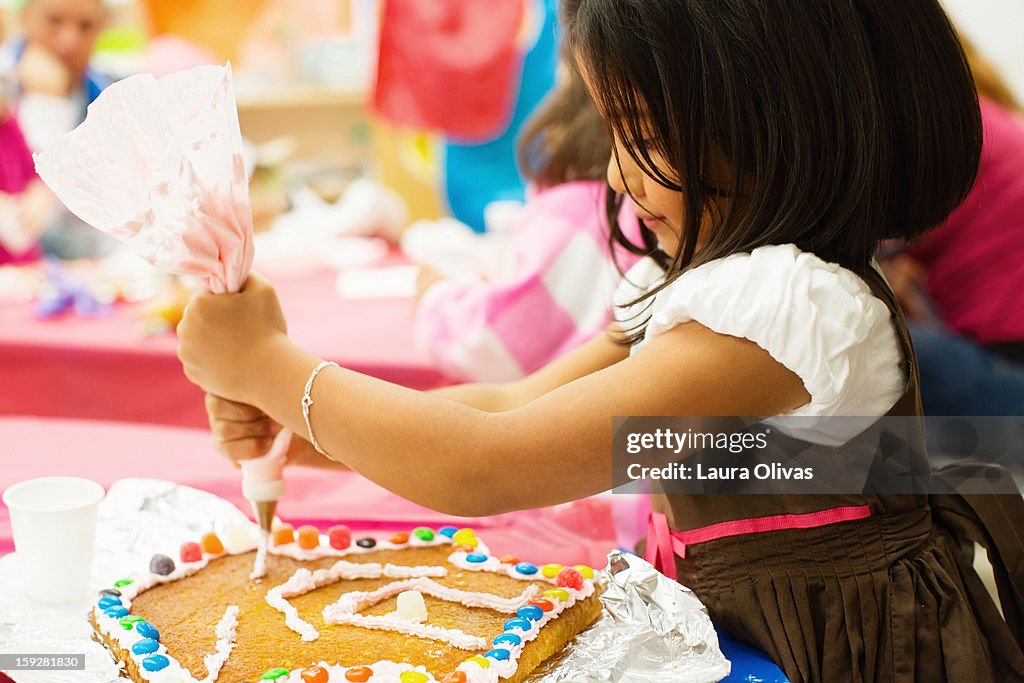 Girl Decorating Cake