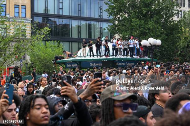 People gather for a "giveaway" event announced by popular Twitch live streamer Kai Cenat in Union Square and the surrounding area on August 4, 2023...