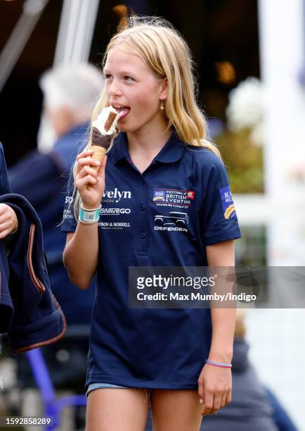 Isla Phillips eats an ice cream as she attends day 1 of the 2023 Festival of British Eventing at Gatcombe Park on August 4, 2023 in Stroud, England.