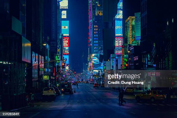 Late night street scene of Times Square, Manhattan, New York City in blue light from 7th Avenue