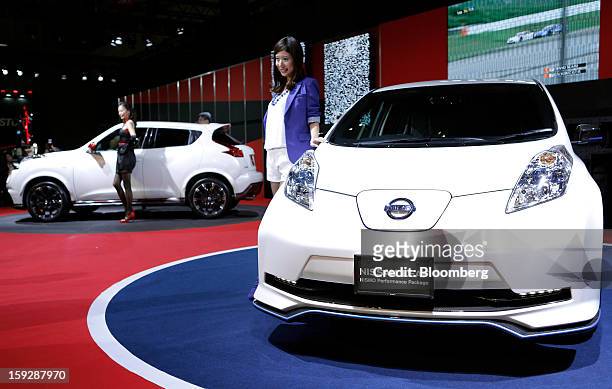 Nissan Motorsports International Co.'s Nissan Leaf Nismo Performance Package, right, and Juke Nismo vehicles are displayed at the Tokyo Auto Salon...