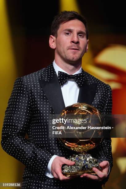 Lionel Messi of Argentina holds the trophy alloft after winning the FIFA Ballon d'Or for a fourth consecutive time during FIFA Ballon d'Or Gala 2012...