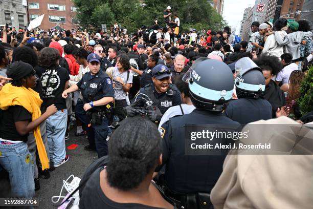 Members of the NYPD respond to the disruptions caused by large crowds during a "giveaway" event hosted by popular Twitch live streamer Kai Cenat in...