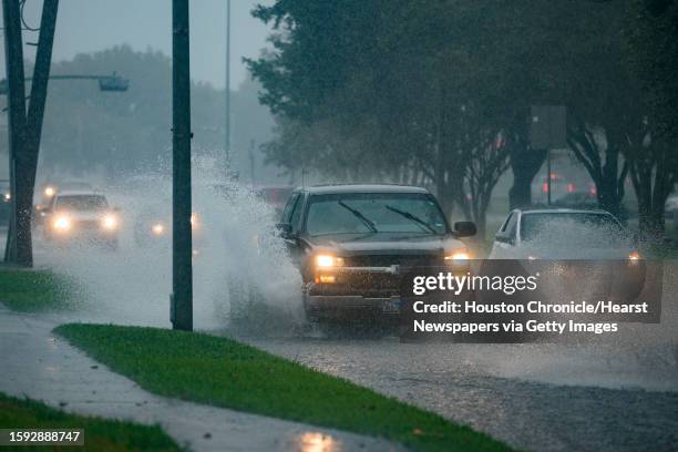 Cars splash through heavy water filling Chimney Rock south of Brays Bayou in Houston, Tuesday, Sept. 17, 2019. A tropical depression in the Gulf of...