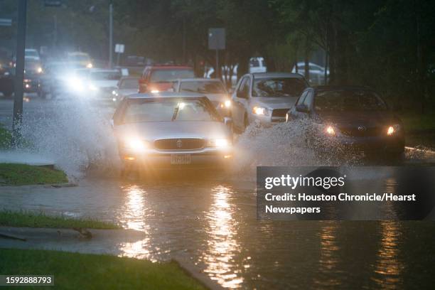 Cars splash through heavy water filling Chimney Rock south of Brays Bayou in Houston, Tuesday, Sept. 17, 2019. A tropical depression in the Gulf of...